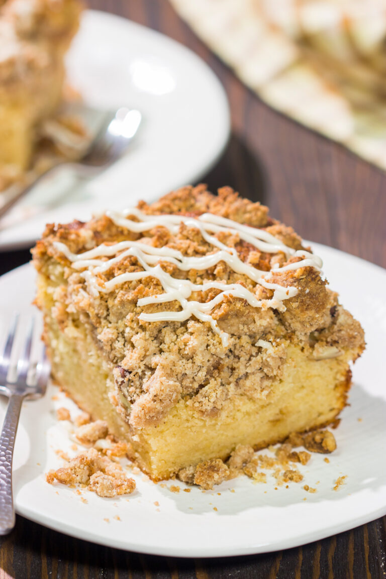 This Maple Pecan Coffee Cake features the cozy flavors of maple, cinnamon and brown sugar. A warm slice of this cake next to a cup of coffee is the perfect way to start a fall day!