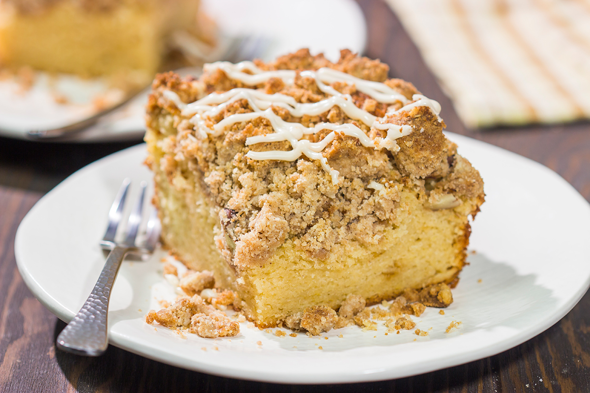 This Maple Pecan Coffee Cake features the cozy flavors of maple, cinnamon and brown sugar. A warm slice of this cake next to a cup of coffee is the perfect way to start a fall day!