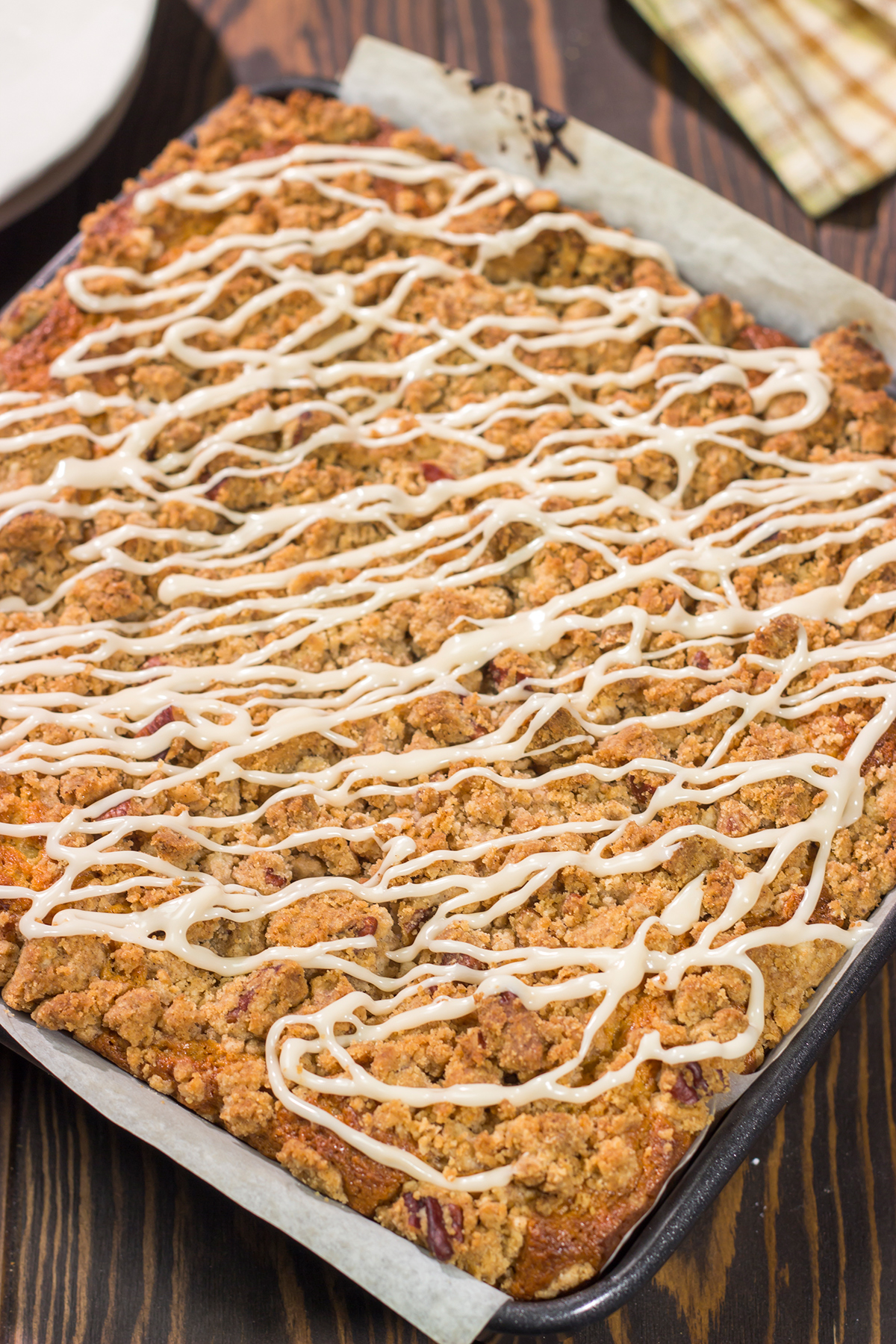 This Maple Pecan Coffee Cake features the cozy flavors of maple, cinnamon and brown sugar. A warm slice of this cake next to a cup of coffee is the perfect way to start a fall day!