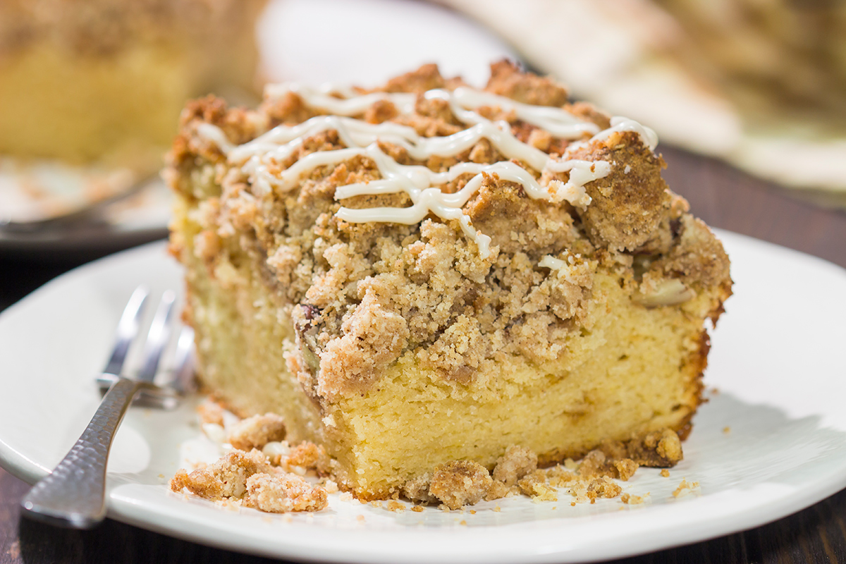 This Maple Pecan Coffee Cake features the cozy flavors of maple, cinnamon and brown sugar. A warm slice of this cake next to a cup of coffee is the perfect way to start a fall day!