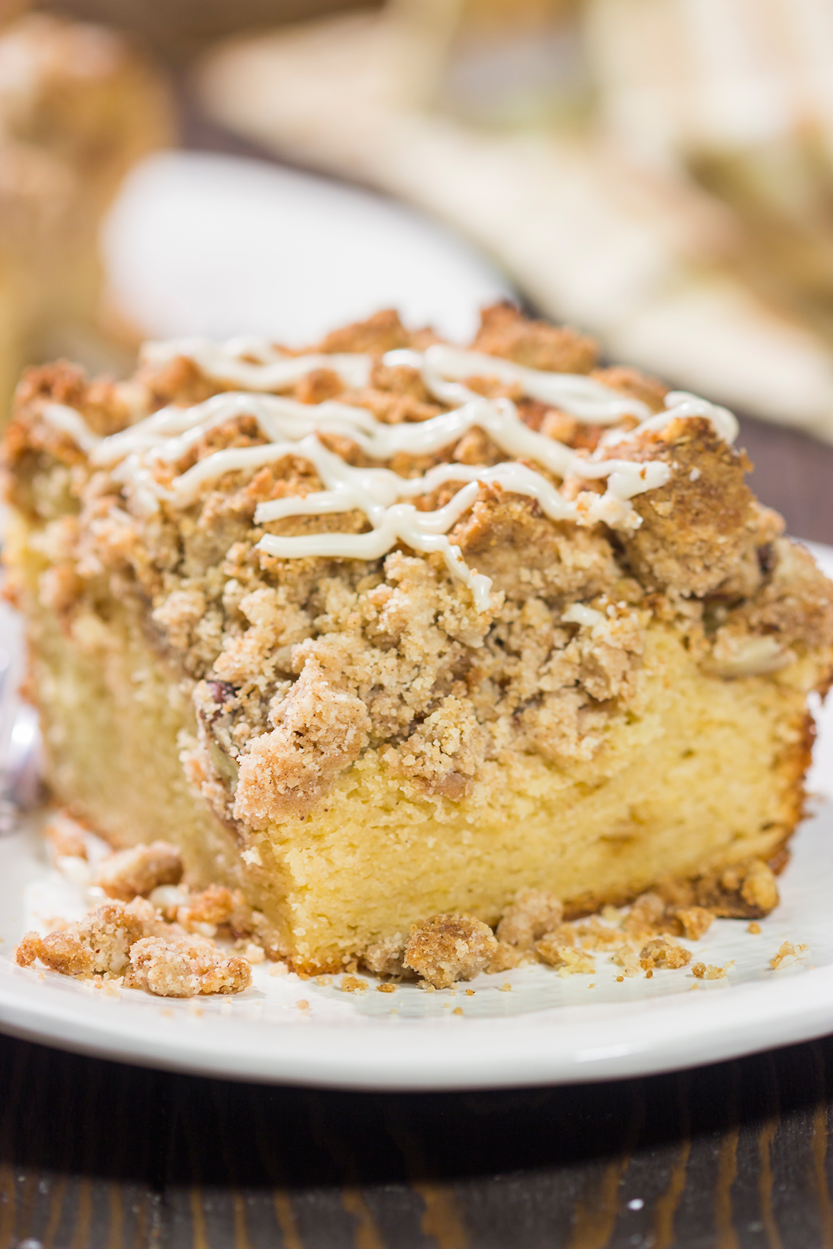 This Maple Pecan Coffee Cake features the cozy flavors of maple, cinnamon and brown sugar. A warm slice of this cake next to a cup of coffee is the perfect way to start a fall day!