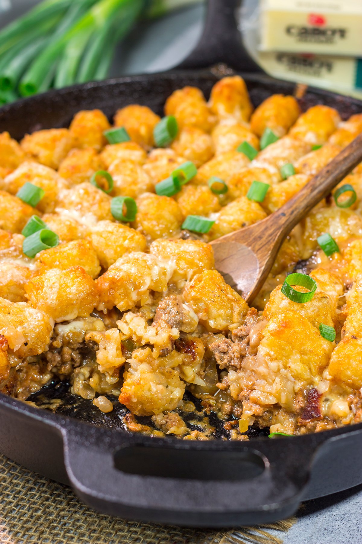 This Bacon Cheeseburger Casserole features all of the flavors of a classic burger + fries...just in casserole form! Grab a skillet and bake this for dinner tonight.