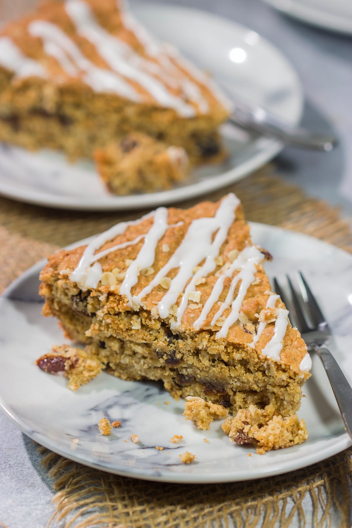 These delicious Oatmeal Raisin Bars taste just like the classic cookie...but they're easier to make. Grab a skillet and bake these bars for dessert tonight!