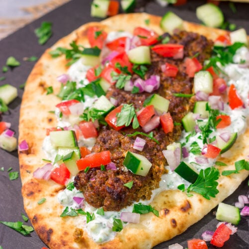 These Sheet Pan Beef Kebabs feature heavily seasoned ground beef served over warm naan. Add in the easy homemade tzatziki sauce, and you've got a delicious dinner plan!
