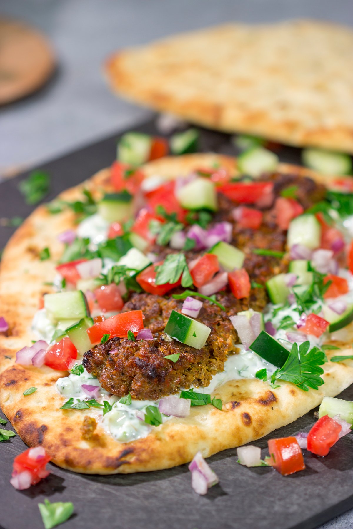 These Sheet Pan Beef Kebabs feature heavily seasoned ground beef served over warm naan. Add in the easy homemade tzatziki sauce, and you've got a delicious dinner plan!