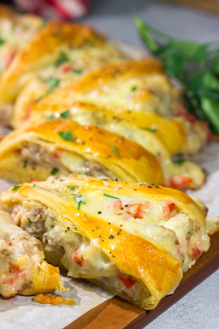 This Cheesy Sausage Wreath features creamy sausage gravy wrapped in golden brown dough. It makes for an excellent holiday breakfast or brunch when guests are in town!