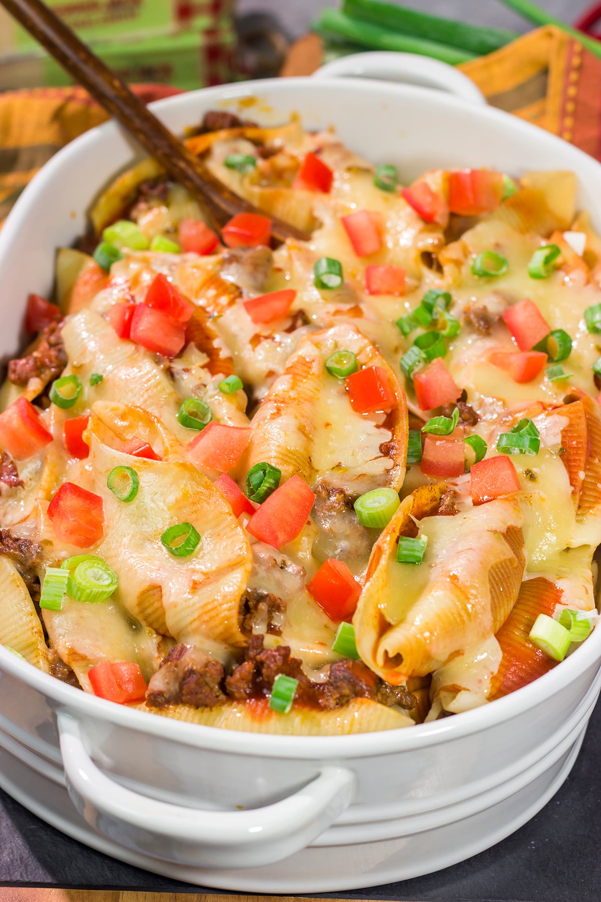 Put a spin on taco night with these Cheesy Taco Stuffed Shells! Instead of tortillas, stuff seasoned taco meat into pasta shells and top it with plenty of melty cheese for a fun family dinner.